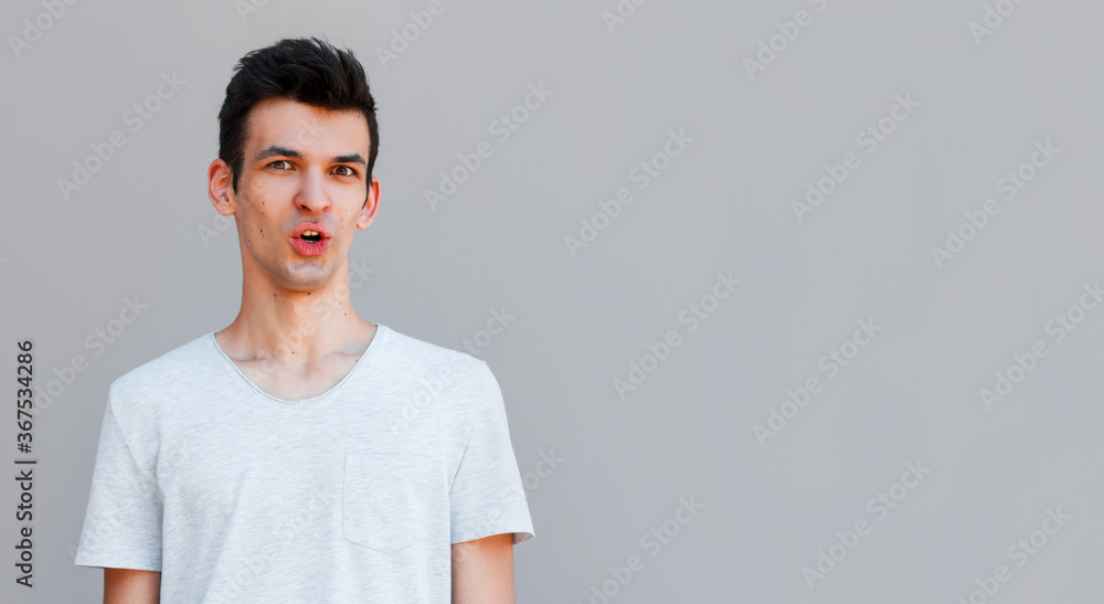 Portrait of shocked male says wow, looks bugged eyes and rounded mouth, being amazed to see something unexpected. Terrified guy with surpised expression. Emotions concept Portrait of shocked male says wow, looks bugged eyes and rounded mouth, being amazed to see something unexpected. Terrified guy with surpised expression. Emotions concept