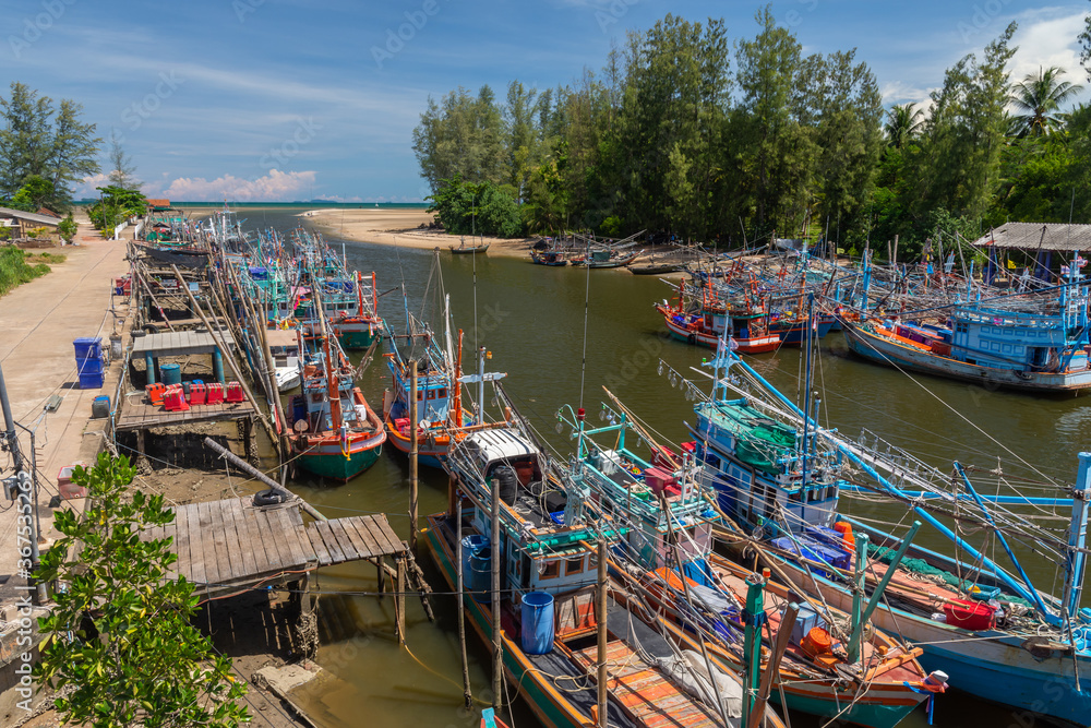 Fisherman boat in fishing port, Thailand. The mouth of the river into the Thai sea 