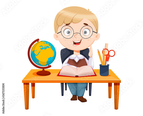 Back to school. Cute schoolgirl sitting at the desk