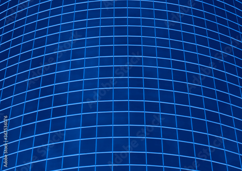 Glass windows on a tall building create a grid of contrasting lines with blue color effect