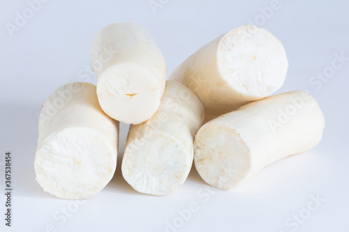 Fresh Cassava root peeled. Isolated on white background. Copy space.