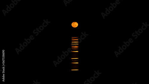 Staircase to the Moon natural phenomenon over the ocean at night in Port Hedland, Western Australia.