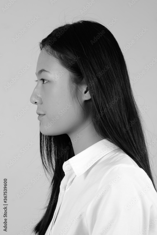 Portrait of young beautiful Asian businesswoman in black and white Portrait of young beautiful Asian businesswoman in black and white