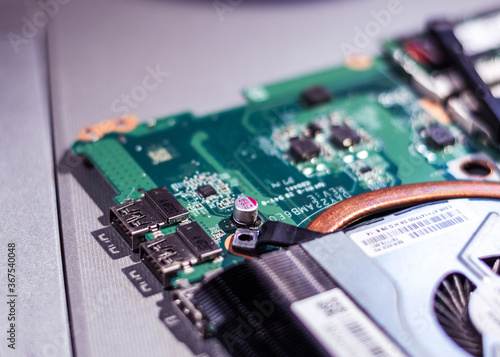 Computer circuit board. Computer repair shop. High technology. Motherboard. Laptop motherboard. Cooler