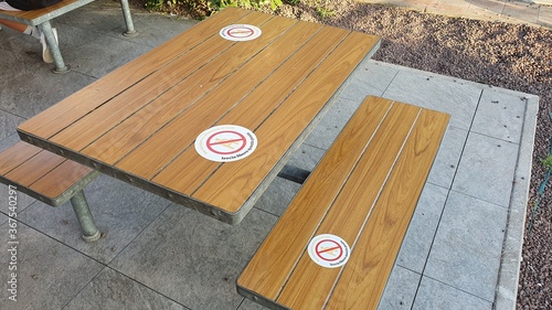 social distancing sign on the tables of a fast food. keep a social distance concept CORONAVIRUS OUTBREAK