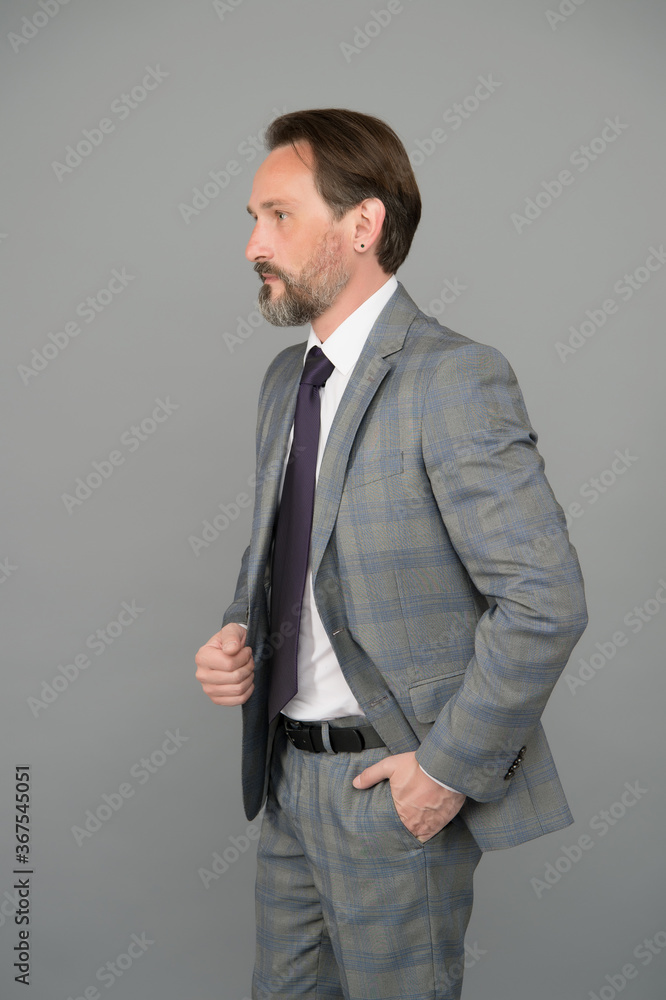 Fototapeta premium Reaching Your Goal. Bearded man in formalwear grey background. Businessman has beard. Hair salon and barbershop. Business casual style. Giving man confidence. Senior employee grey background