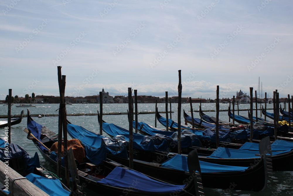 Venetian motives of the gondola at the pier