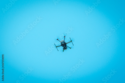 Fototapeta Naklejka Na Ścianę i Meble -  Drone flying in the blue sky