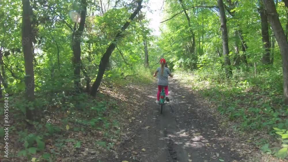 Young mother and daughter with bikes on forest. Young mother and daughter with bikes on forest.