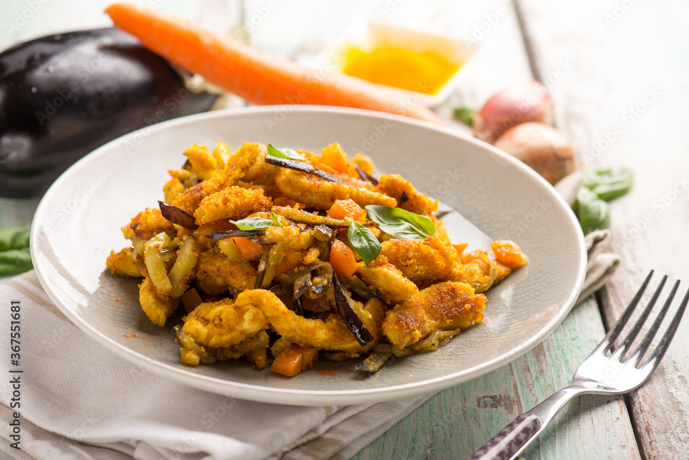 chicken stewed with eggpalnts carrots basil and turmeric spice chicken stewed with eggpalnts carrots basil and turmeric spice