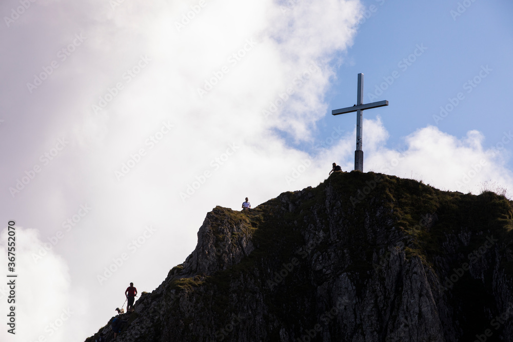 People summit a Peak in Bavaria mountains, South Germany. Europe People summit a Peak in Bavaria mountains, South Germany. Europe