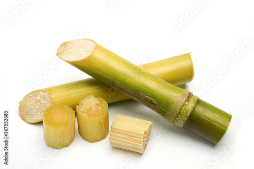 sugar cane and brown sugar on white isolate background