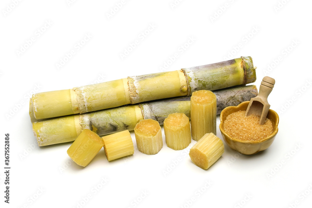 sugar cane and brown sugar on white isolate background