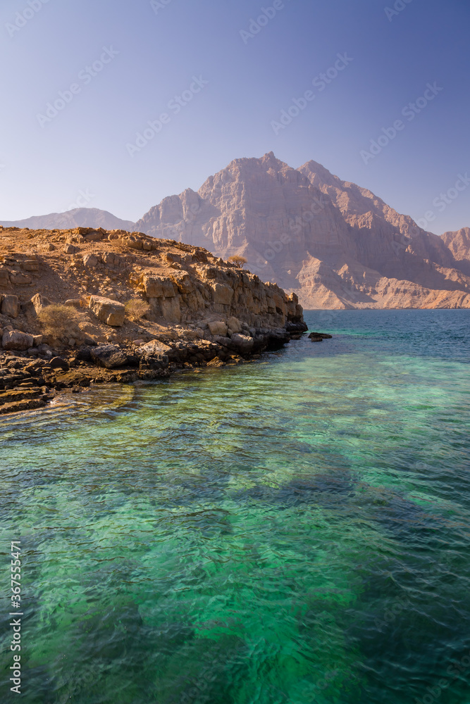 Coastal Khasab Scenery in Oman. Beautiful coastal scenery near Khasab, in Musandam peninsula, Oman, photo taken from a boat during a tour.
