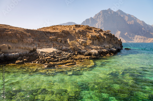 Coastal Khasab Scenery in Oman. Beautiful coastal scenery near Khasab, in Musandam peninsula, Oman, photo taken from a boat during a tour.
 photo