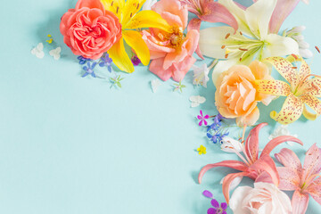 frame of beautiful garden flowers on paper background