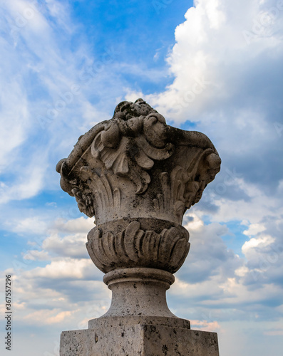 Stone sculpture with clouds and storm in the background