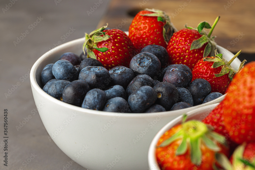 Close up photo of blueberries and strawberries Close up photo of blueberries and strawberries