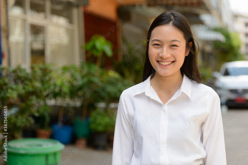 Portrait of young beautiful Asian businesswoman outdoors Portrait of young beautiful Asian businesswoman outdoors
