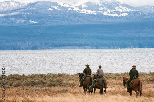 Fototapeta National Park rangers checking things out along Lake Yellowstone;  Yellowstone N