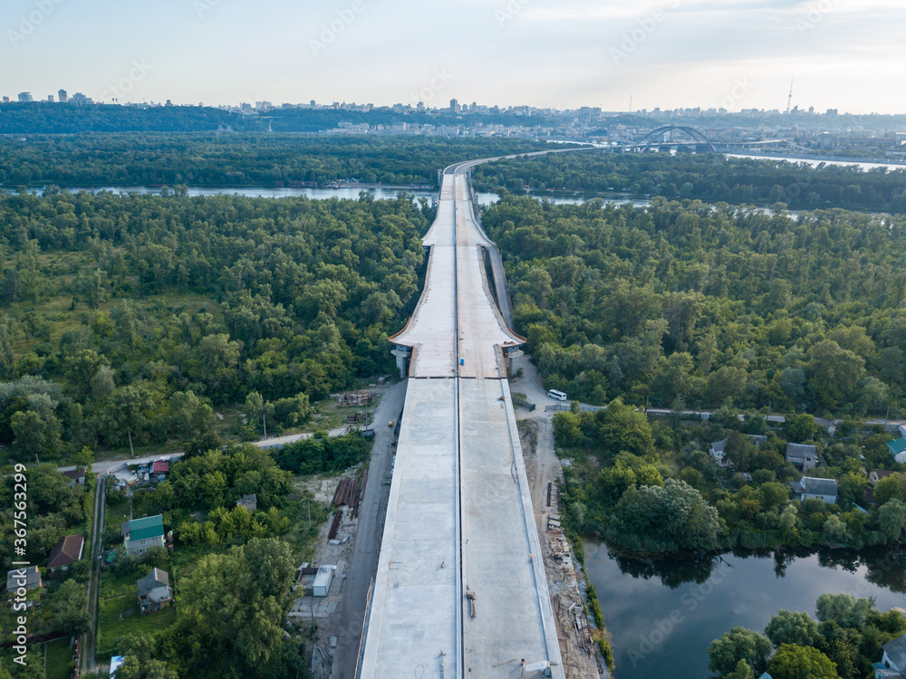 Aerial drone view. Construction of a bridge across the Dnieper river in Kiev.