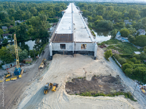 Aerial drone view. Construction of a bridge across the Dnieper river in Kiev.