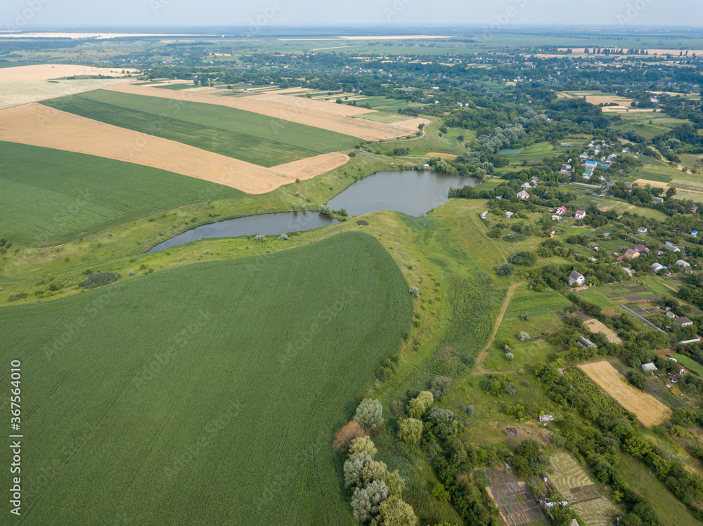 Agricultural fields in the Ukrainian village. Aerial drone view.