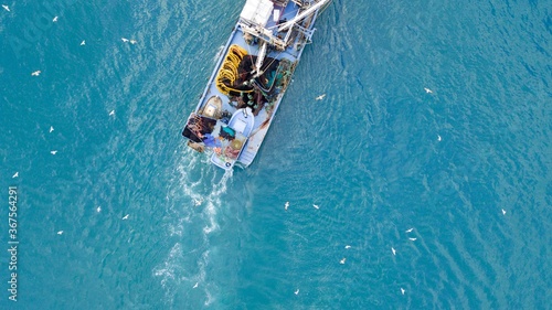 aerial view of the fishing boat at the sea
