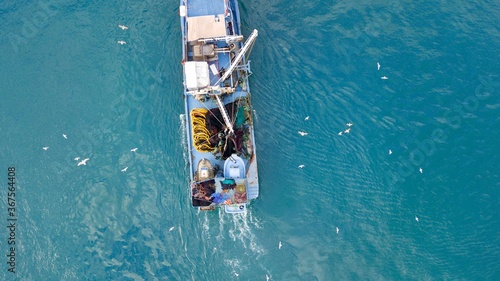 aerial view of the fishing boat at the sea