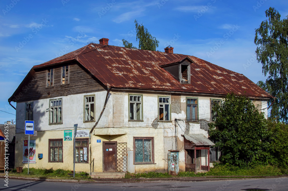 Textured old pre revolutionary abandoned house between Russia and Estonia