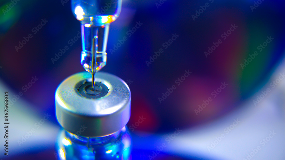 Vaccine vial dose flu shot drug needle syringe,medical concept vaccination hypodermic injection treatment disease care hospital prevention immunization illness disease baby child.blue background Vaccine vial dose flu shot drug needle syringe,medical concept vaccination hypodermic injection treatment disease care hospital prevention immunization illness disease baby child.blue background