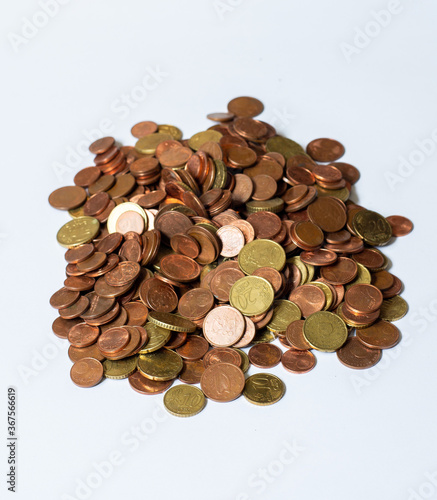 a pile of loose change. used european coins on white background. Euro