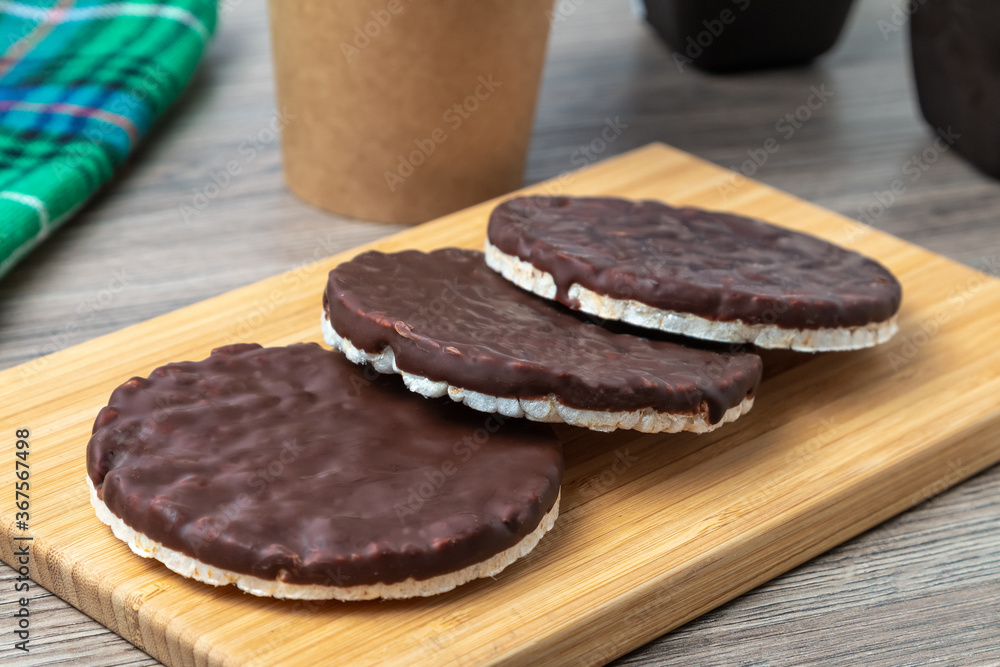 Rice cakes with chocolate on a kitchen table Rice cakes with chocolate on a kitchen table