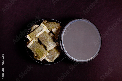 Box of Swedish nicotine, Swedish snus, chewing tobacco on a black background