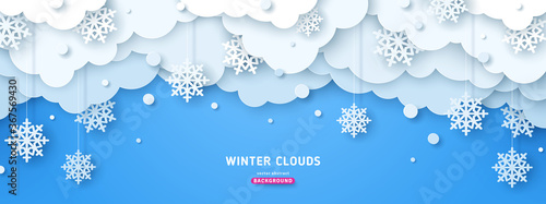 Paper cut clouds with snow fall on blue sky background. Snowflakes holiday banner for Christmas and New Year Design. Vector illustration