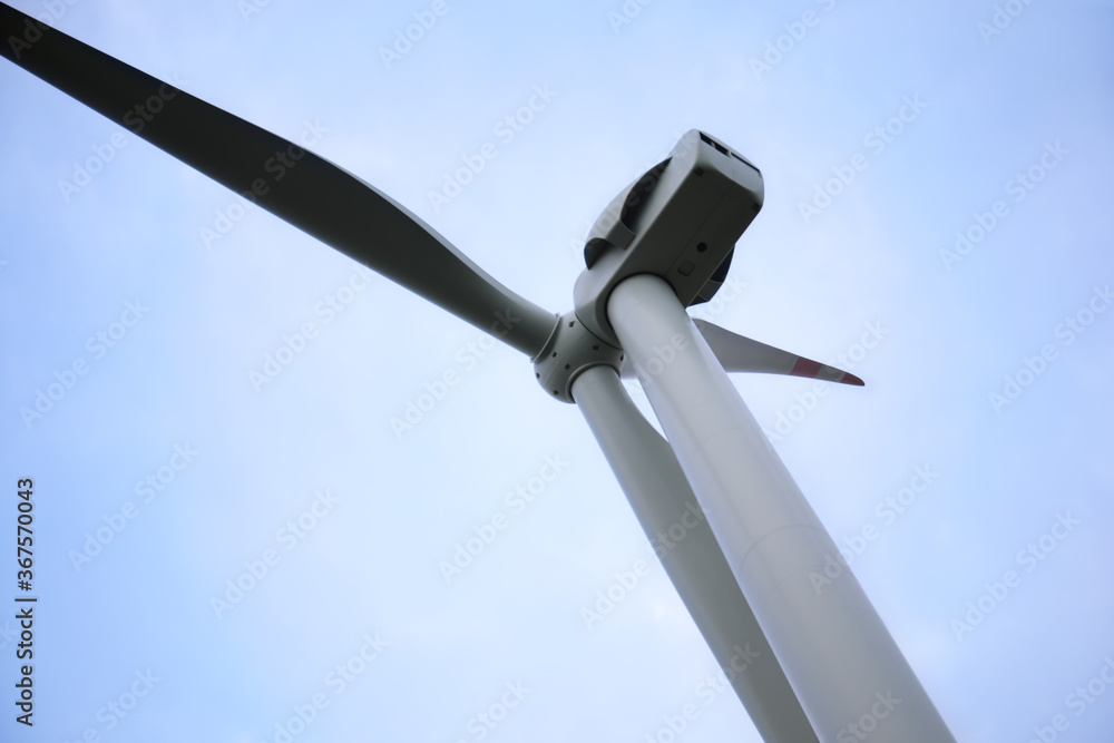 Wind turbine against beautiful sky, closeup. Alternative energy source Wind turbine against beautiful sky, closeup. Alternative energy source