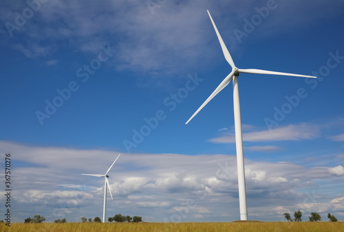 Beautiful view of field with wind turbines. Alternative energy source © New Africa