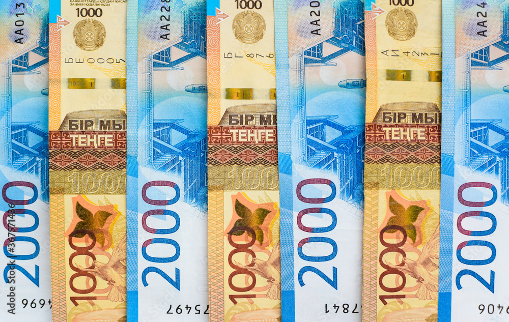 Russian rubles and Kazakhstani tenge. Money background. Financial crisis, ruble devaluation concept. Russian and Kazakh currencies. Currency exchange. Russian rubles and Kazakhstani tenge. Money background. Financial crisis, ruble devaluation concept. Russian and Kazakh currencies. Currency exchange.