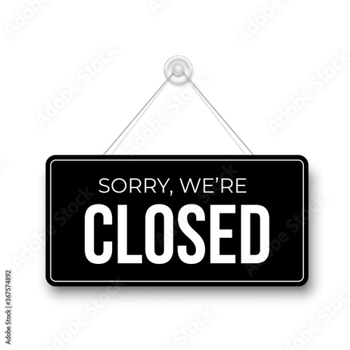 Closed signboard hanged on wall. Black rectangular shape clipboard for retail, shop, store, cafe, bar, restaurant. Announcement template with opportunity to visit. Object isolated on white background.