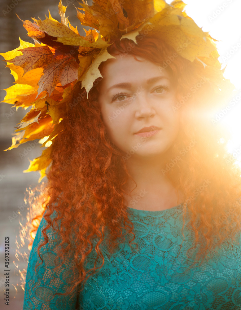 a young woman with red hair in the background of the sun