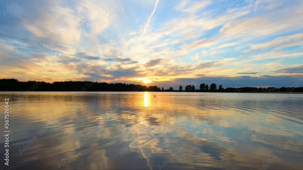 Beautiful calm background of sunset near the lake Beautiful calm background of sunset near the lake