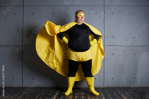 fantastic fat superhero man is defender of universe, ready to solve all problems, brave and strong. isolated photo