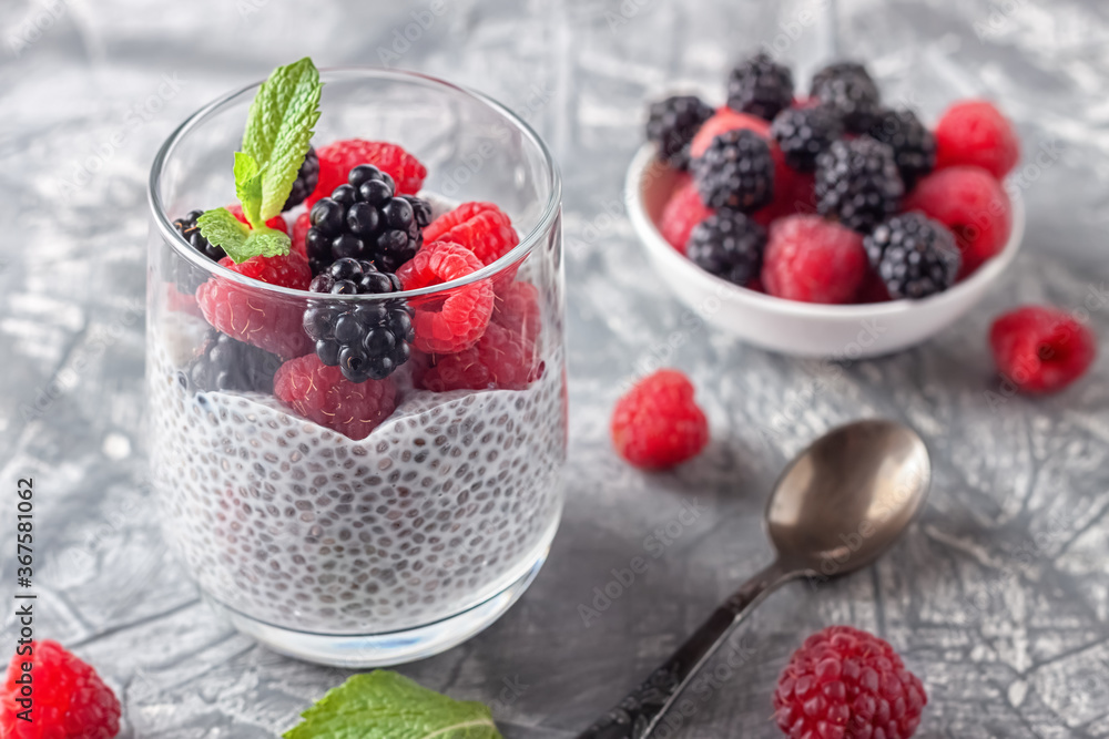 Vegan healthy food. Chia pudding with coconut milk, fresh raspberries and blackberries Vegan healthy food. Chia pudding with coconut milk, fresh raspberries and blackberries