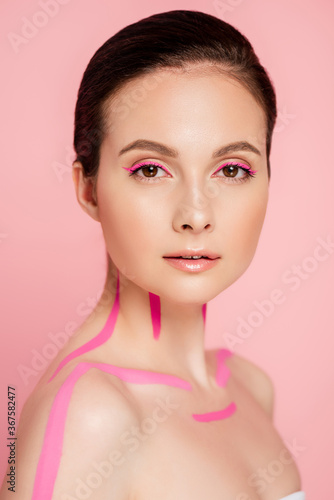 naked beautiful woman with pink lines on body isolated on pink