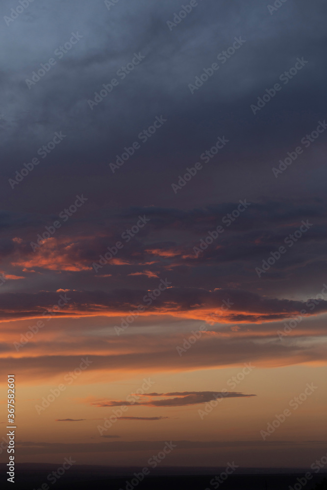 Purple-magenta clouds. Tragic gloomy sky. Landscape with bloody sunset. Fantastic skies on the planet earth. Twilight, nightfall. Purple-magenta clouds. Tragic gloomy sky. Landscape with bloody sunset. Fantastic skies on the planet earth. Twilight, nightfall.