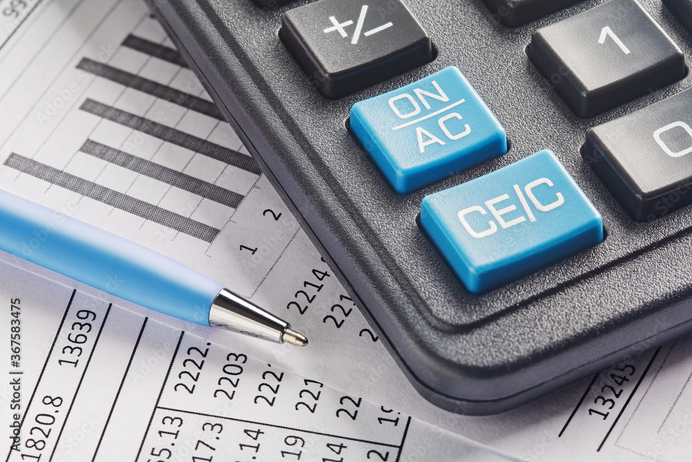 accounting document with pen and calculator. Concept of banking, financial report and financial audit. accounting document with pen and calculator. Concept of banking, financial report and financial audit.