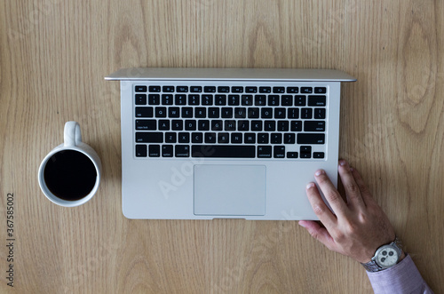 Young boy with a notebook and a cup of coffee