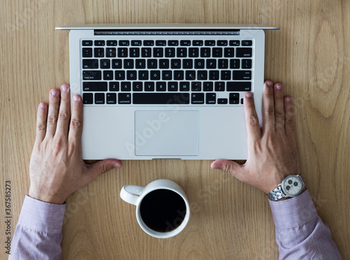 Young boy with a notebook and a cup of coffee