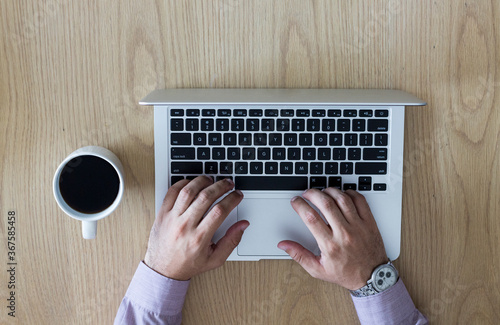 Young boy with a notebook and a cup of coffee