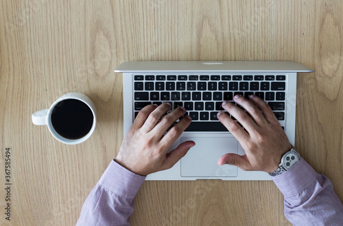 Young boy with a notebook and a cup of coffee